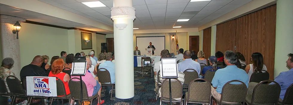 Party members at a caucus meeting